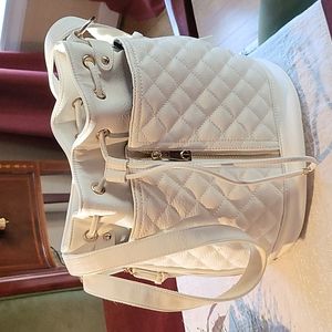 Steve Madden WHITE drawstring backpack.
